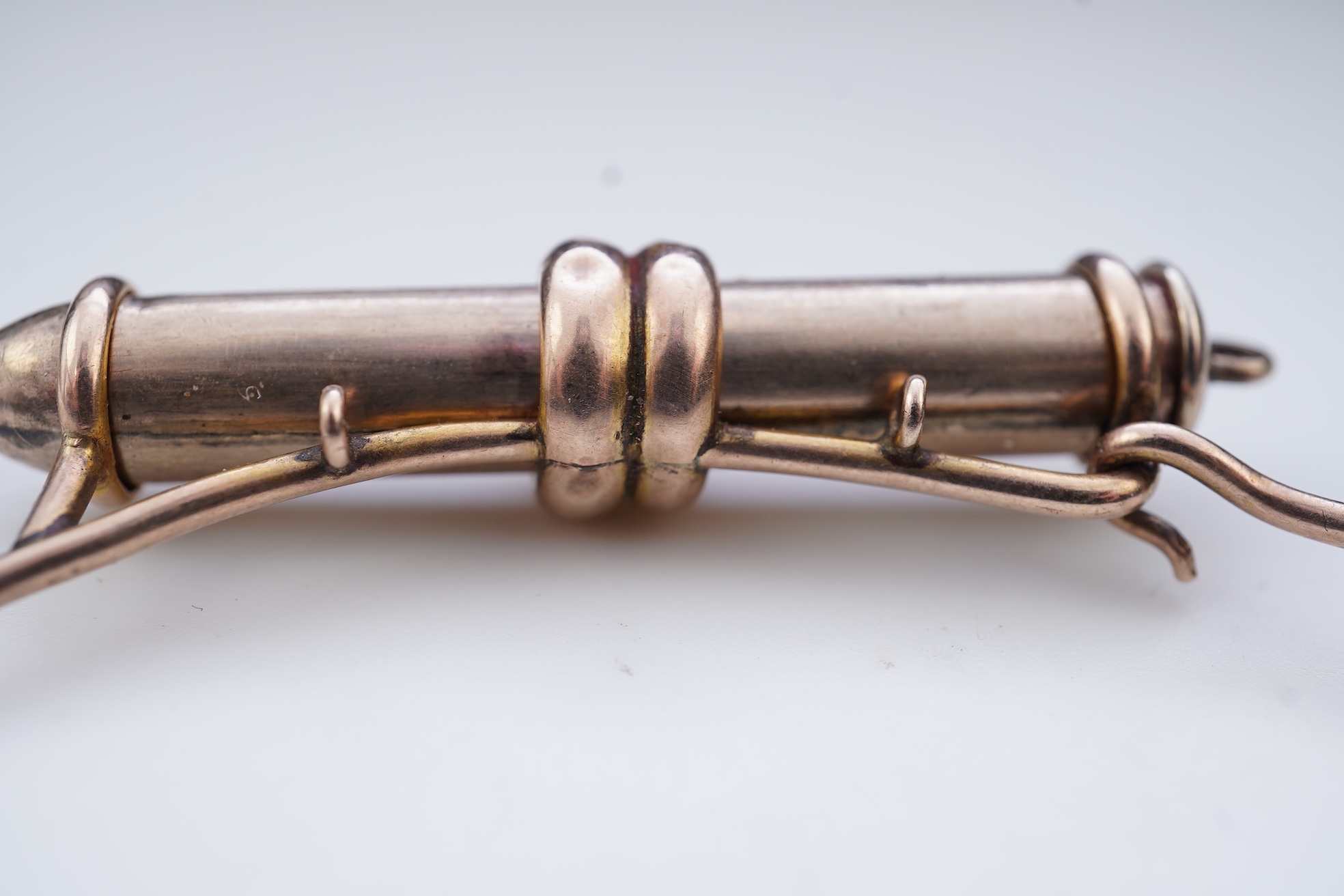 A gold bracelet and propelling pencil, first half 20th century